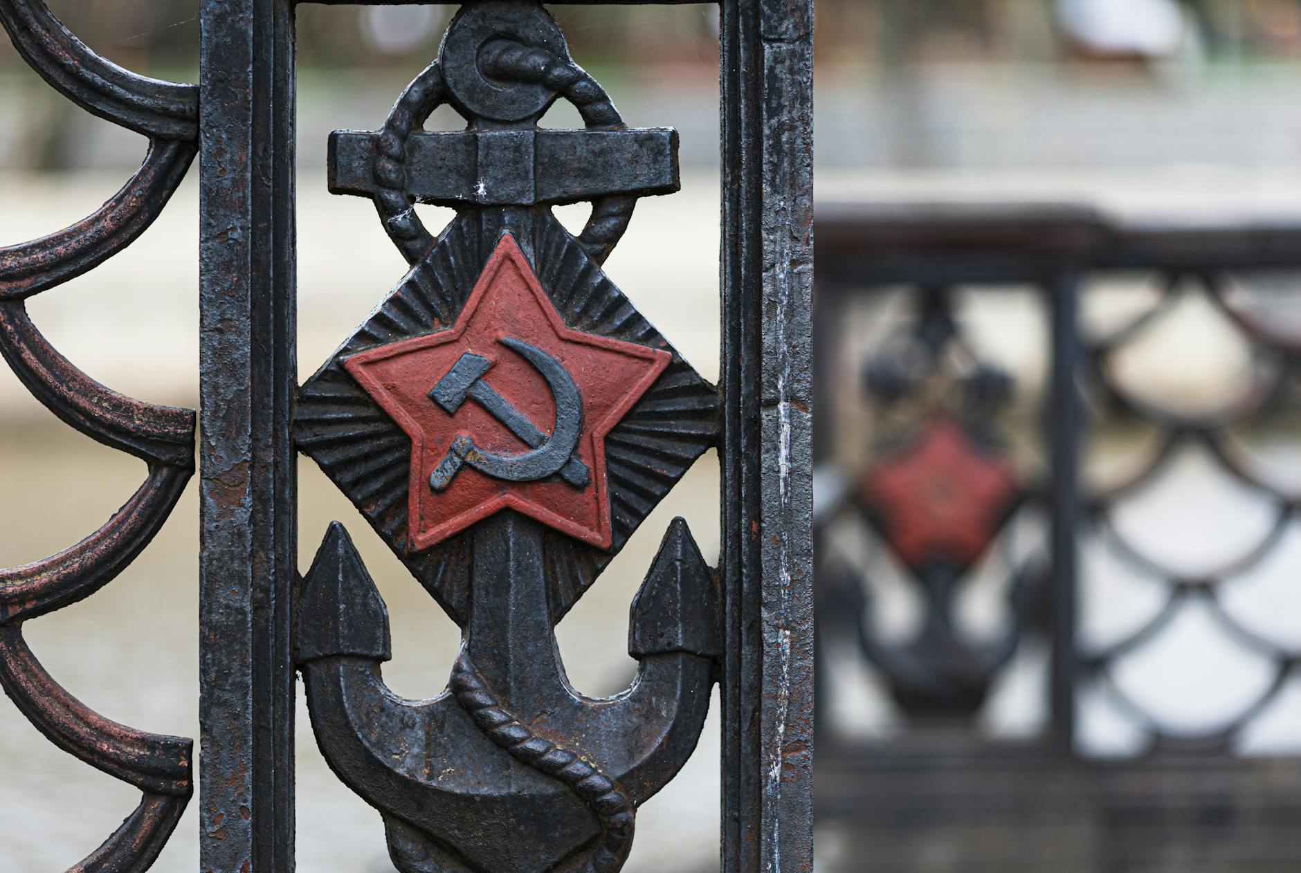 rusty soviet anchor with hammer and sickle symbol