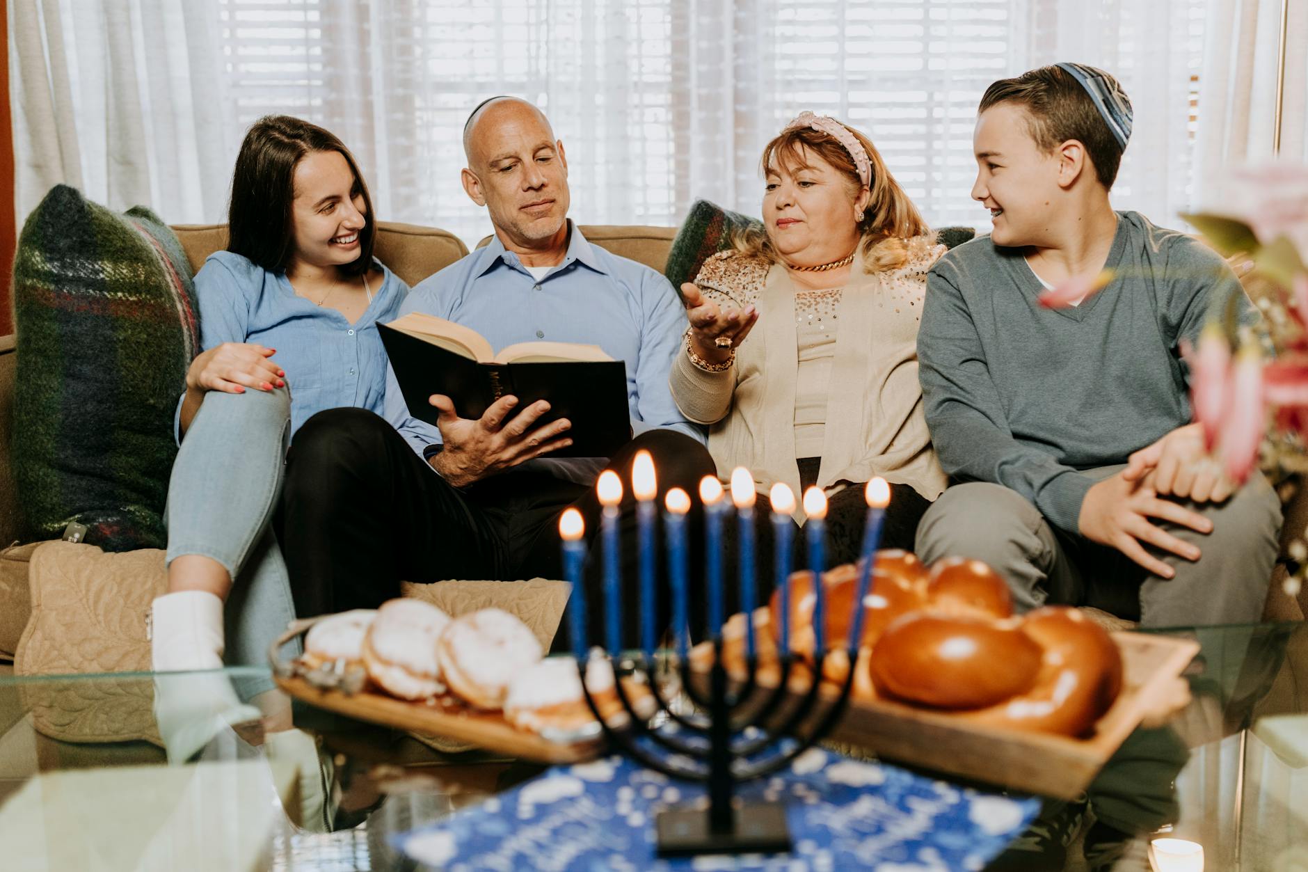 photo of family sitting on a sofa